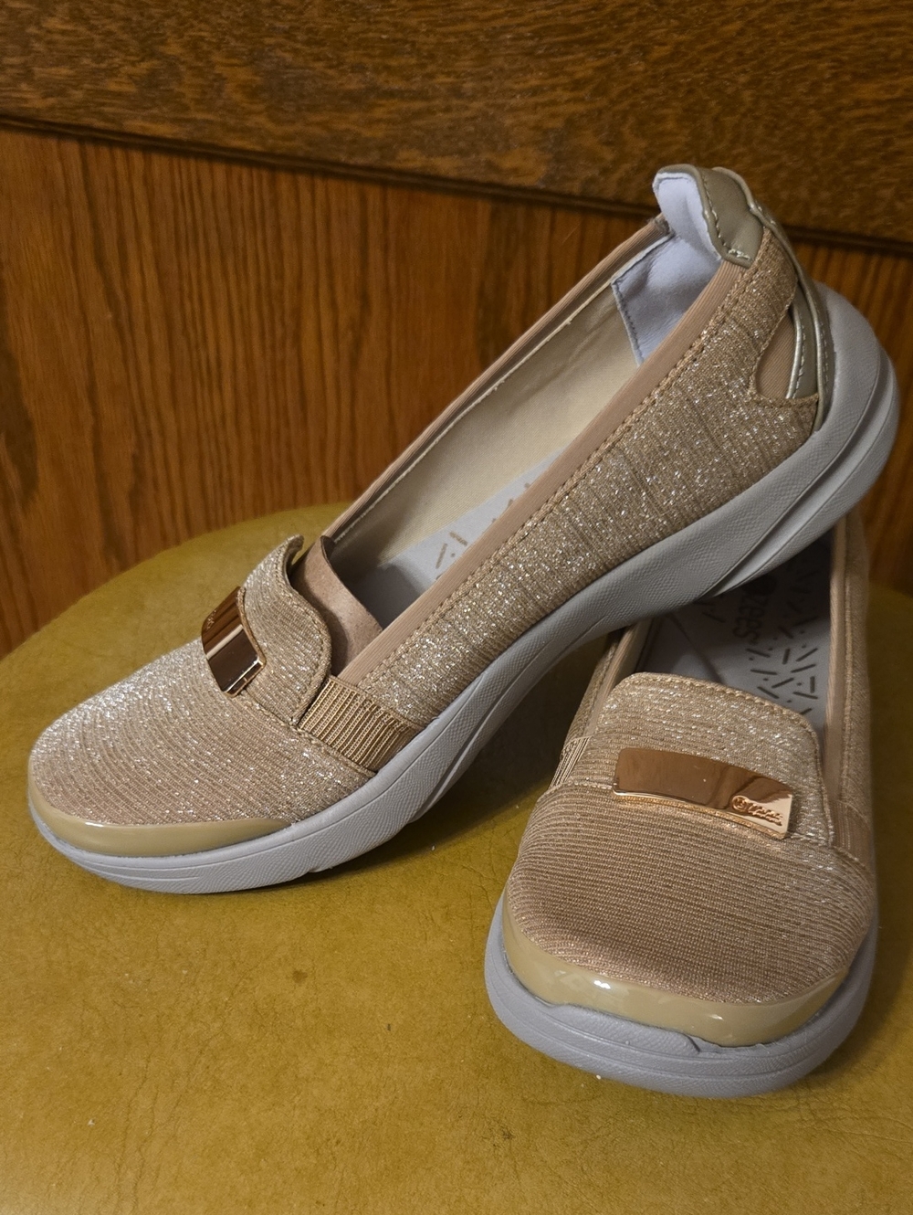Bzees Women's Shimmer Slip-On Loafer in Beige with Gold Accent